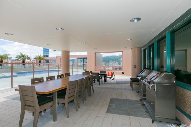 view of patio / terrace featuring outdoor dining space and a community pool