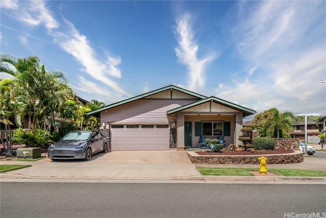 view of front of home with driveway and an attached garage