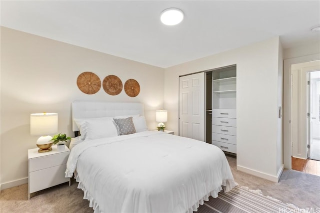 bedroom featuring carpet floors, a closet, and baseboards