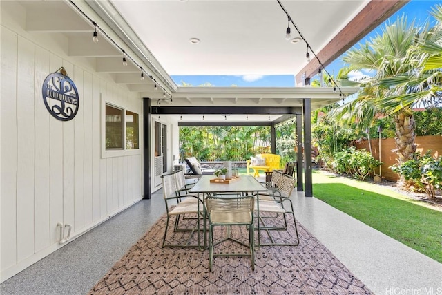 view of patio / terrace featuring outdoor dining space and fence