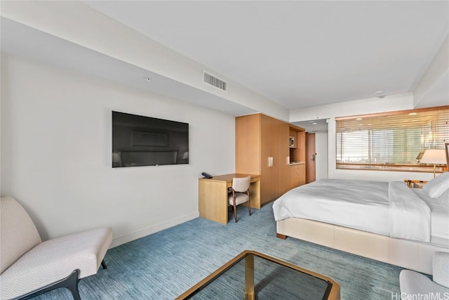 carpeted bedroom featuring baseboards and visible vents