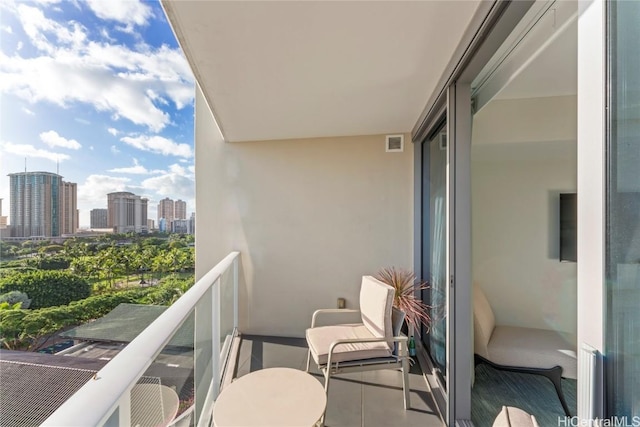 balcony with a city view and visible vents