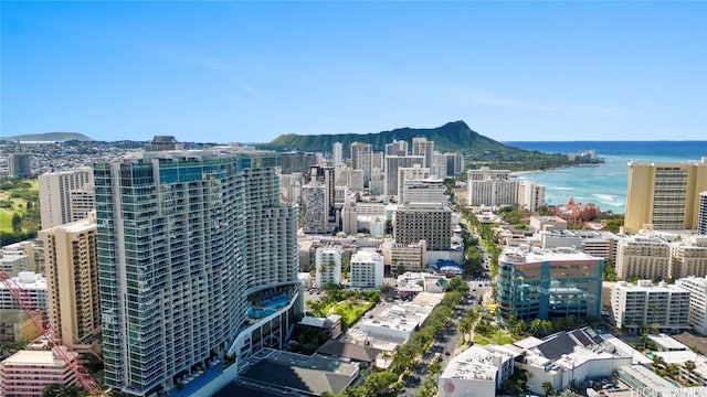 property's view of city featuring a water and mountain view