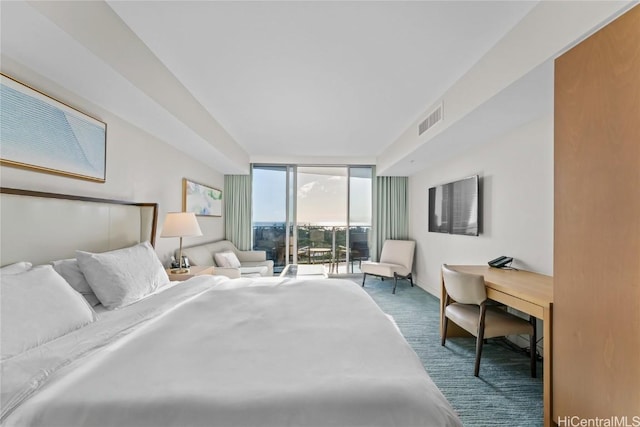 carpeted bedroom featuring access to exterior, visible vents, and a wall of windows