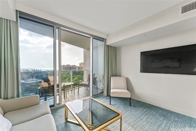 carpeted living area featuring baseboards and visible vents