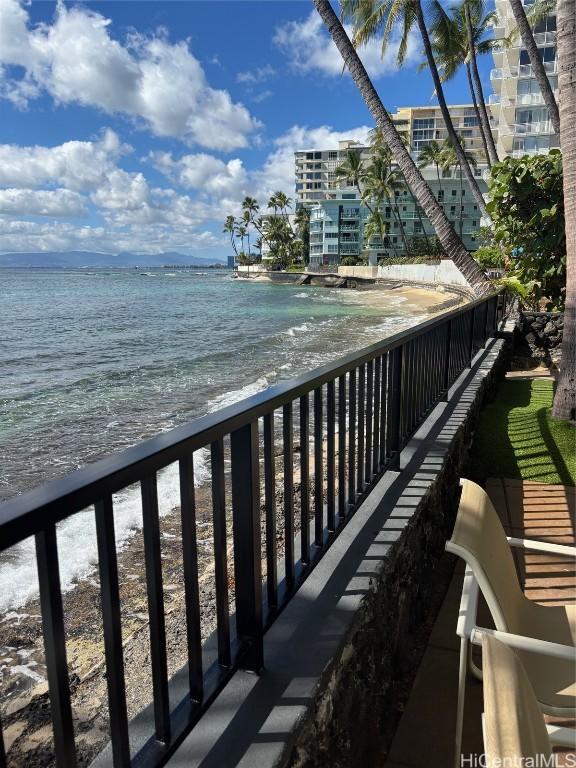 balcony featuring a water view