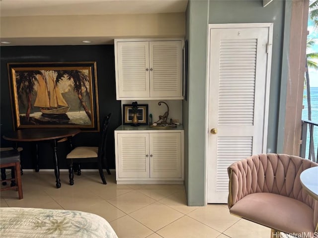 bedroom featuring light tile patterned floors