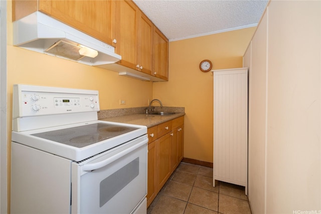 kitchen featuring under cabinet range hood, light tile patterned floors, a sink, light countertops, and electric range