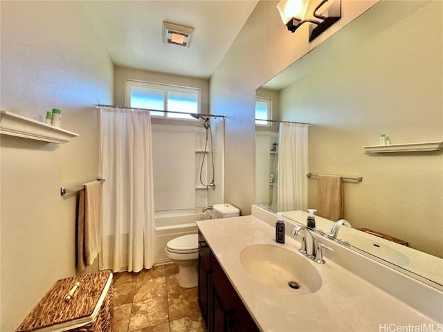 bathroom with toilet, shower / bath combination with curtain, and vanity