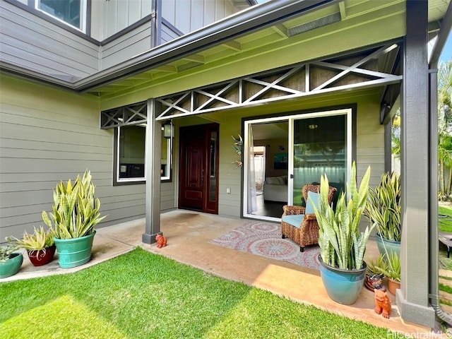 property entrance featuring board and batten siding