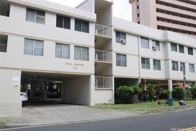 view of property with concrete driveway