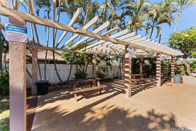 view of patio / terrace with fence and a pergola