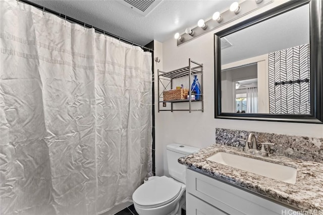 bathroom with visible vents, a shower with shower curtain, toilet, a textured ceiling, and vanity