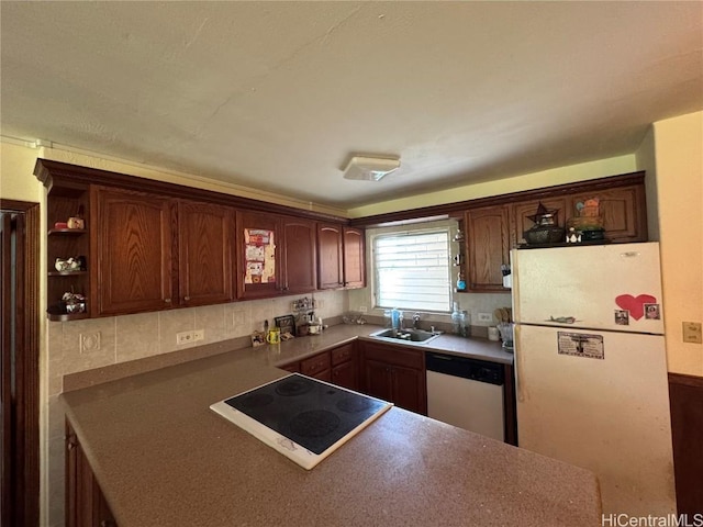 kitchen with white appliances and a sink