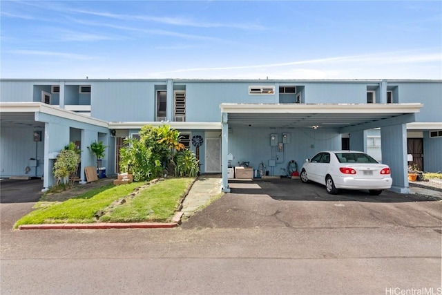 view of property featuring aphalt driveway