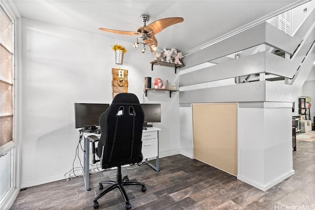 home office featuring ceiling fan, wood finished floors, and baseboards