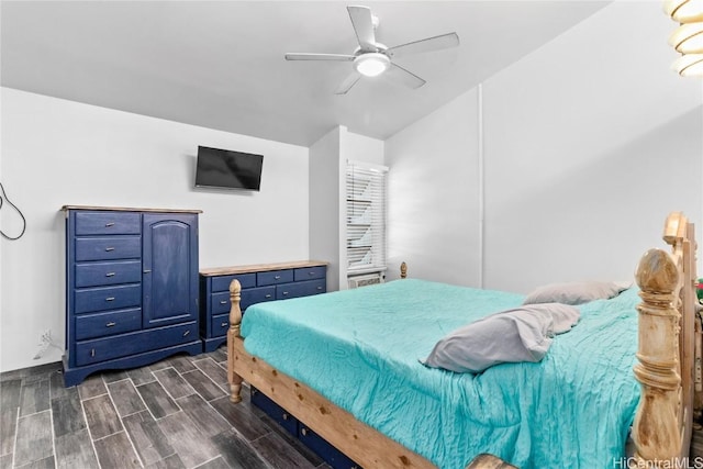 bedroom with a ceiling fan and wood tiled floor