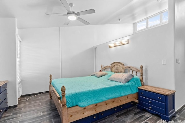 bedroom with ceiling fan, baseboards, and wood finish floors