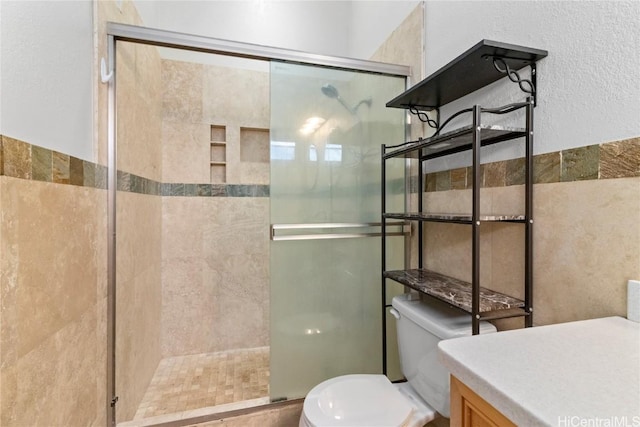 full bath featuring a stall shower and toilet