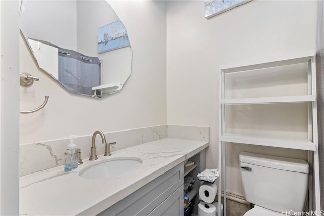 bathroom with vanity and toilet