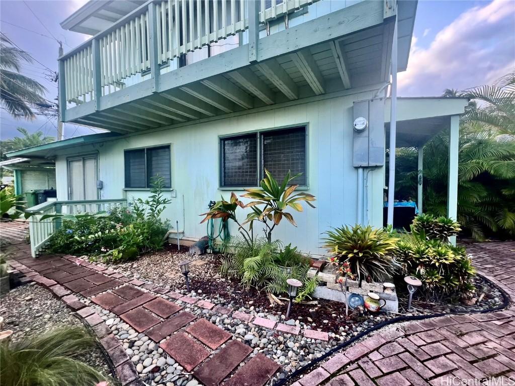 view of side of property featuring a balcony