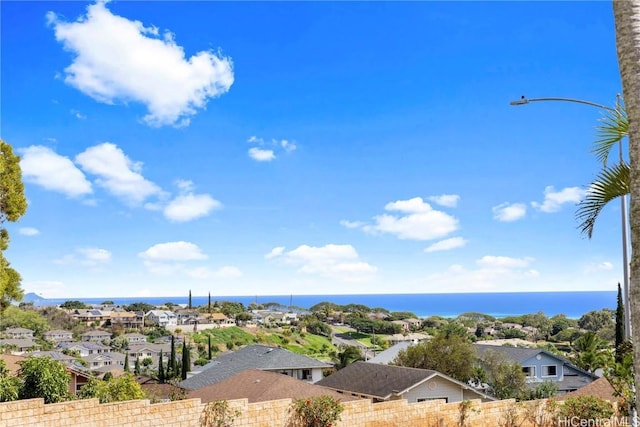 drone / aerial view featuring a residential view and a water view