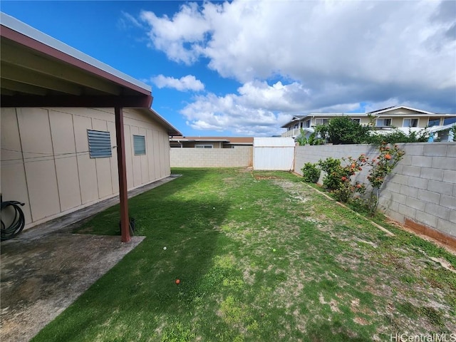 view of yard with a fenced backyard