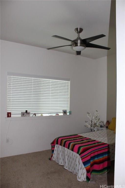 bedroom featuring carpet floors, multiple windows, and ceiling fan