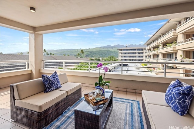 balcony with outdoor lounge area and a mountain view