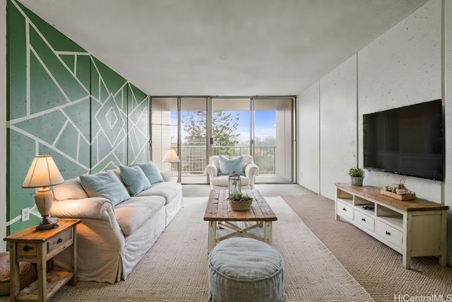 living room with floor to ceiling windows and carpet flooring