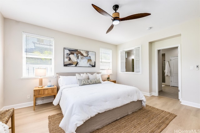 bedroom with baseboards, a ceiling fan, and light wood-style floors