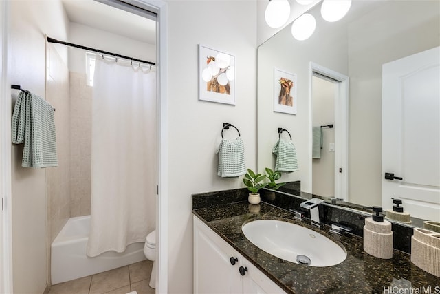 full bathroom featuring vanity, shower / bath combo with shower curtain, tile patterned flooring, and toilet