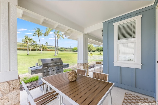 view of patio / terrace with outdoor dining space and a grill