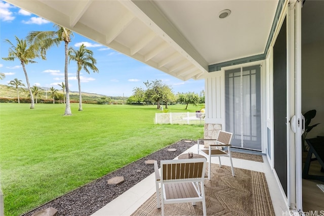 view of patio featuring fence