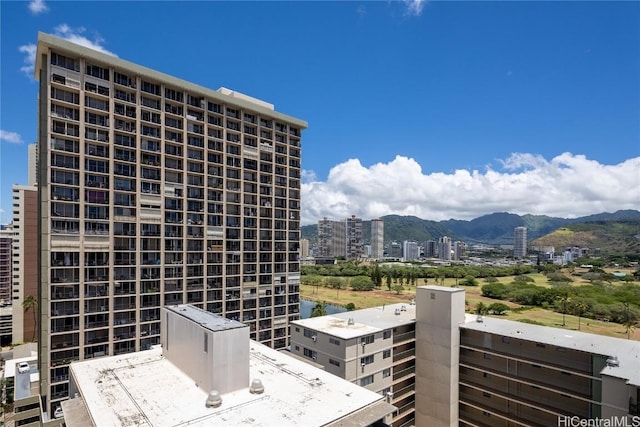 exterior space featuring a mountain view and a city view