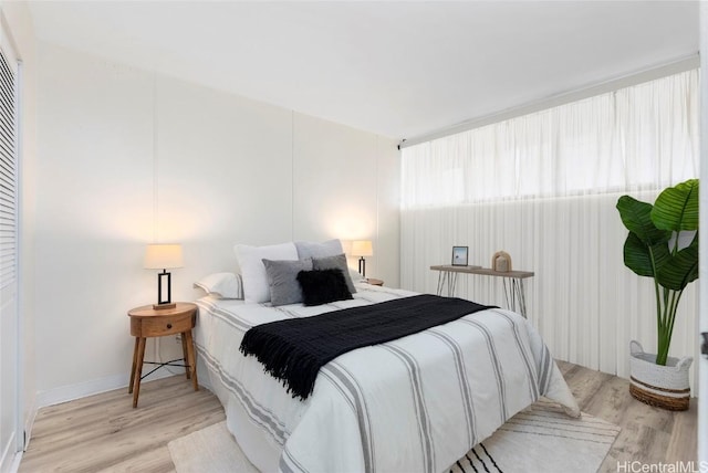 bedroom with light wood-type flooring