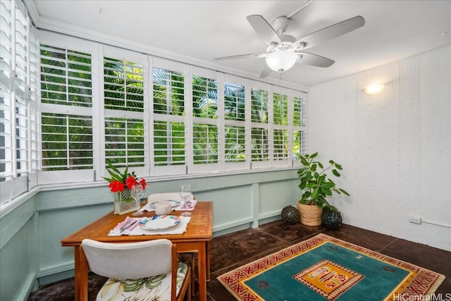 sunroom / solarium featuring ceiling fan