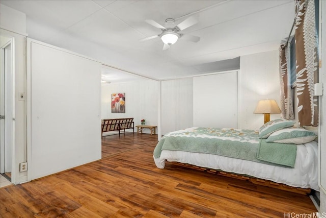 bedroom with ceiling fan and wood finished floors