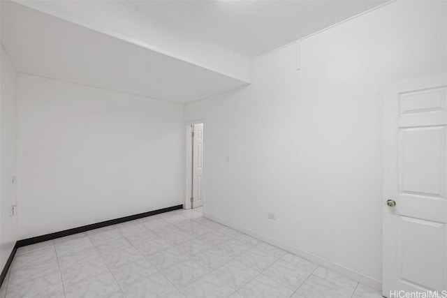 empty room with baseboards