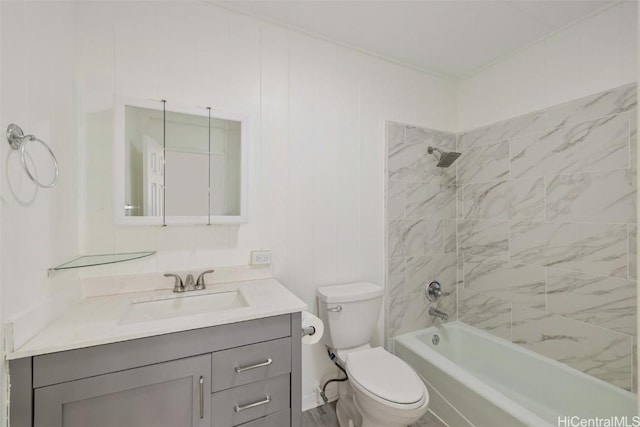 bathroom with tub / shower combination, vanity, and toilet