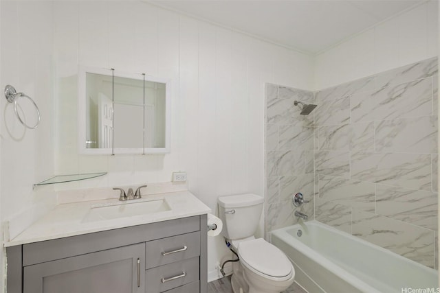 bathroom featuring toilet, vanity, and bathtub / shower combination