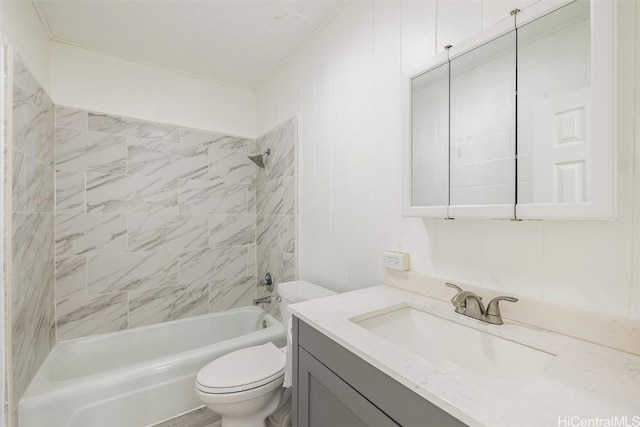 bathroom featuring toilet, vanity, and shower / bathing tub combination