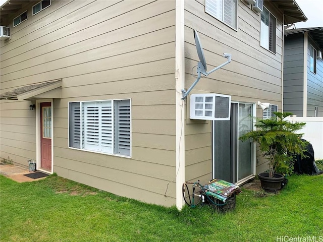 view of side of property with a lawn