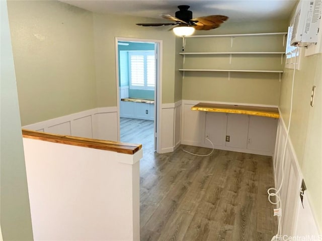 interior space featuring wainscoting and wood finished floors