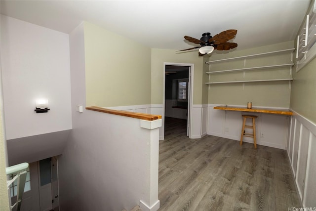 91-1016C Hoomaka St Unit 78, Ewa Beach, HI 96706 - empty room with wainscoting, wood finished floors, and ceiling fan