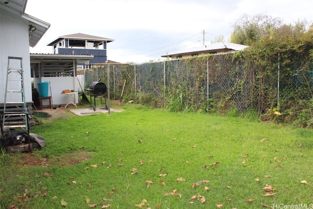 view of yard with a fenced backyard