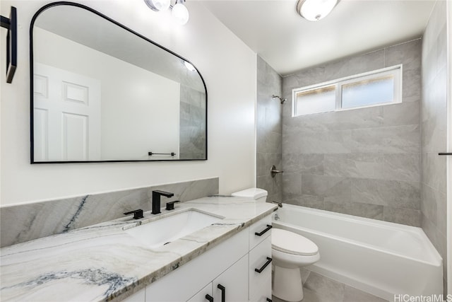 full bath with tub / shower combination, toilet, and vanity