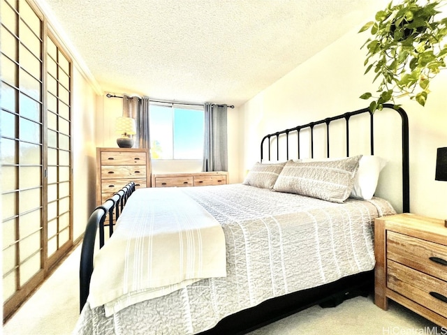 carpeted bedroom with a textured ceiling