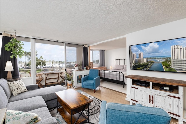 1676 Ala Moana Blvd Unit 205, Honolulu, HI 96815 - living area with a textured ceiling and wood finished floors