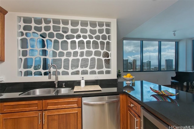 kitchen with beverage cooler, a sink, dishwasher, brown cabinetry, and dark countertops